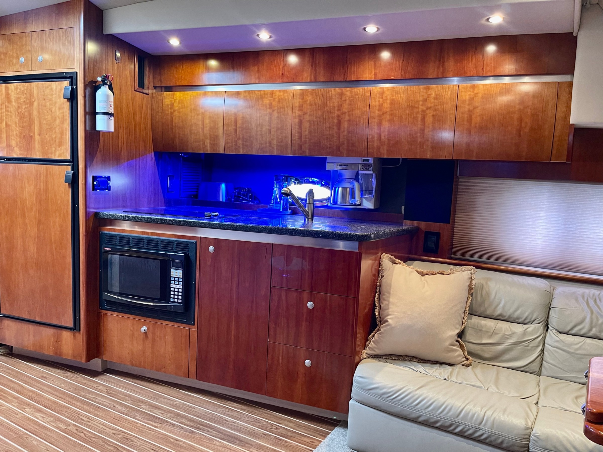 a kitchen with wooden cabinets