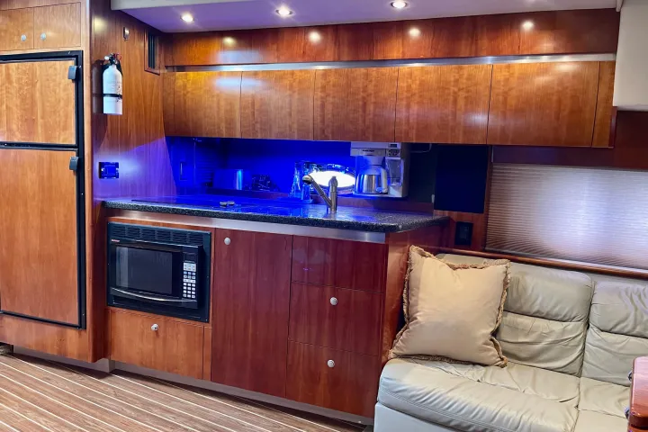 a kitchen with wooden cabinets