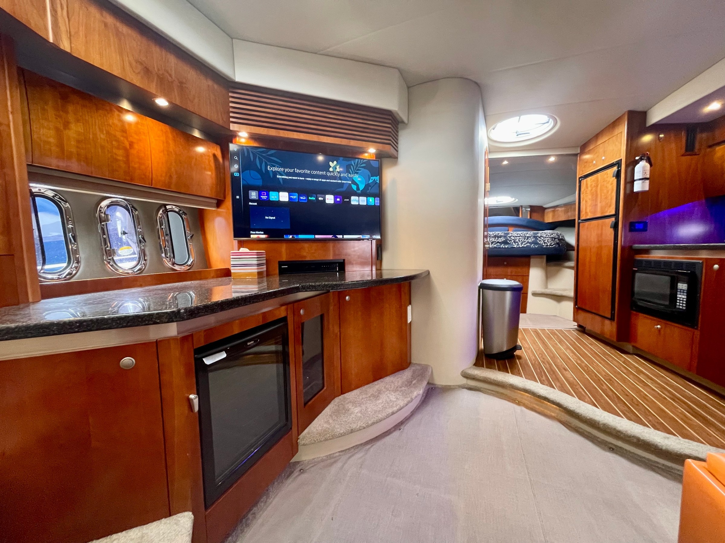 a kitchen with a flat screen tv