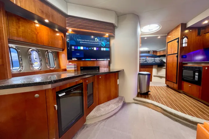 a kitchen with a flat screen tv