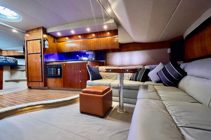 a bedroom with a bed and desk in a room