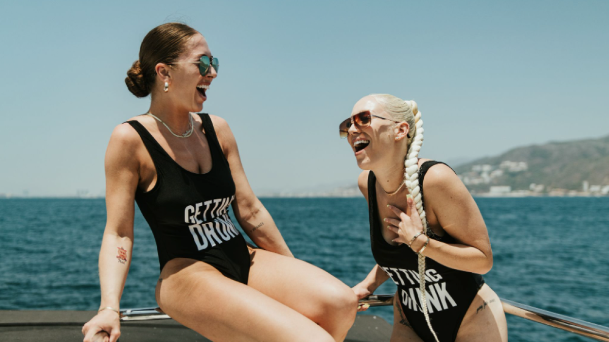 a person standing next to a body of water