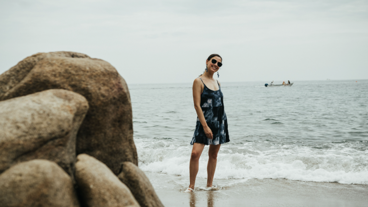 a man standing on a rocky beach
