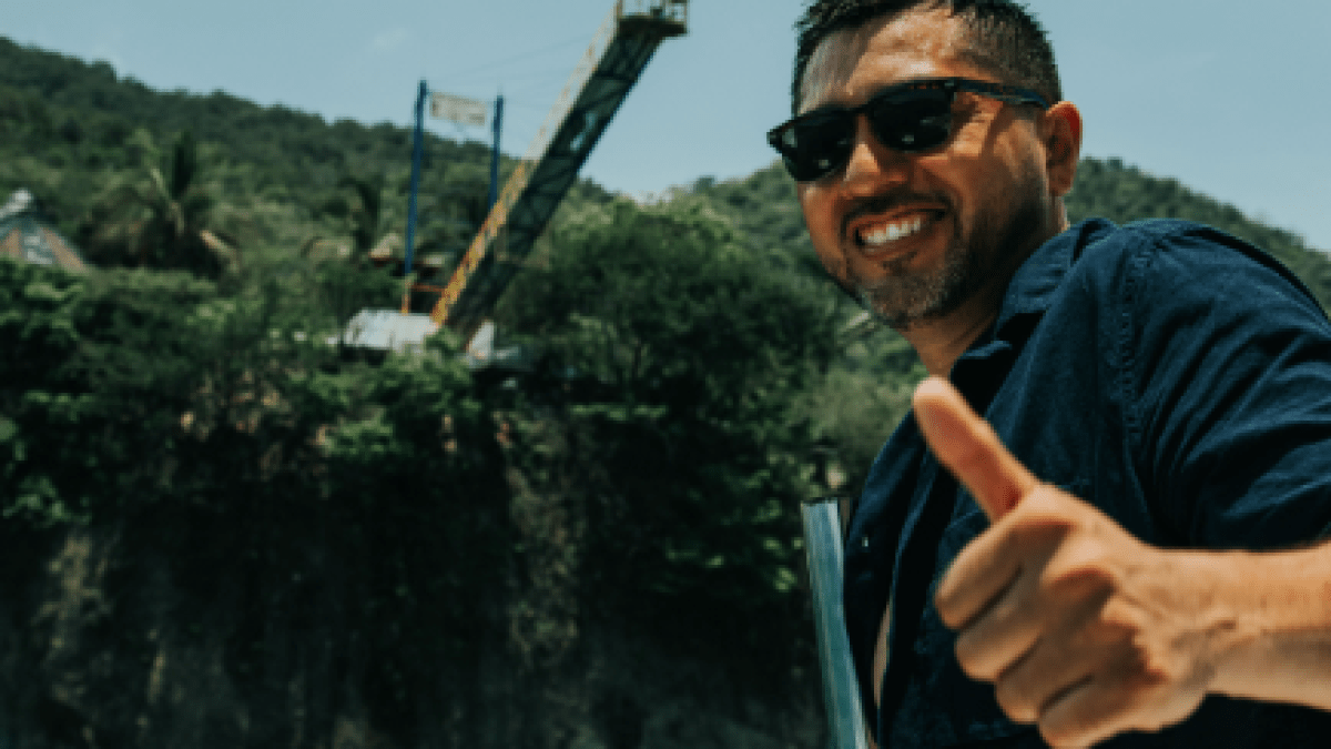 a man holding a glass of water