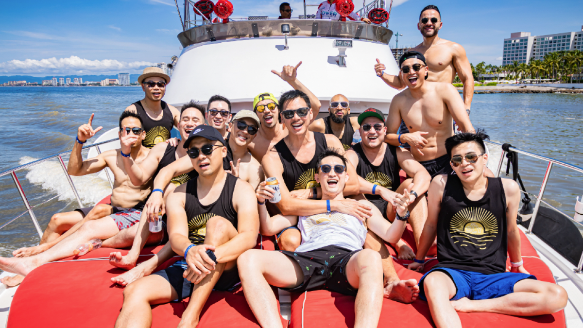 a group of people sitting in a boat on a body of water