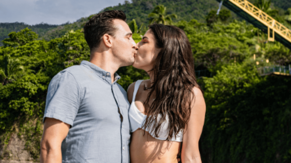a man and a woman sitting on a bench