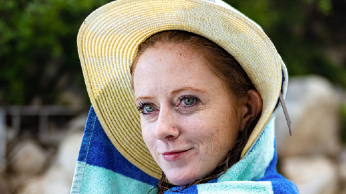 a close up of a person wearing a hat