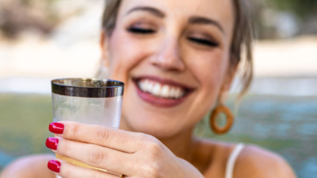 a woman holding a cup