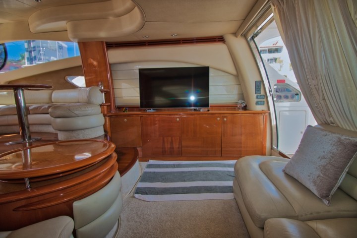 a living room filled with furniture and a large window