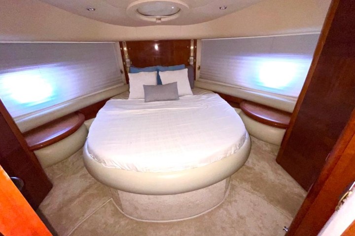 a bedroom with a bed and a chair