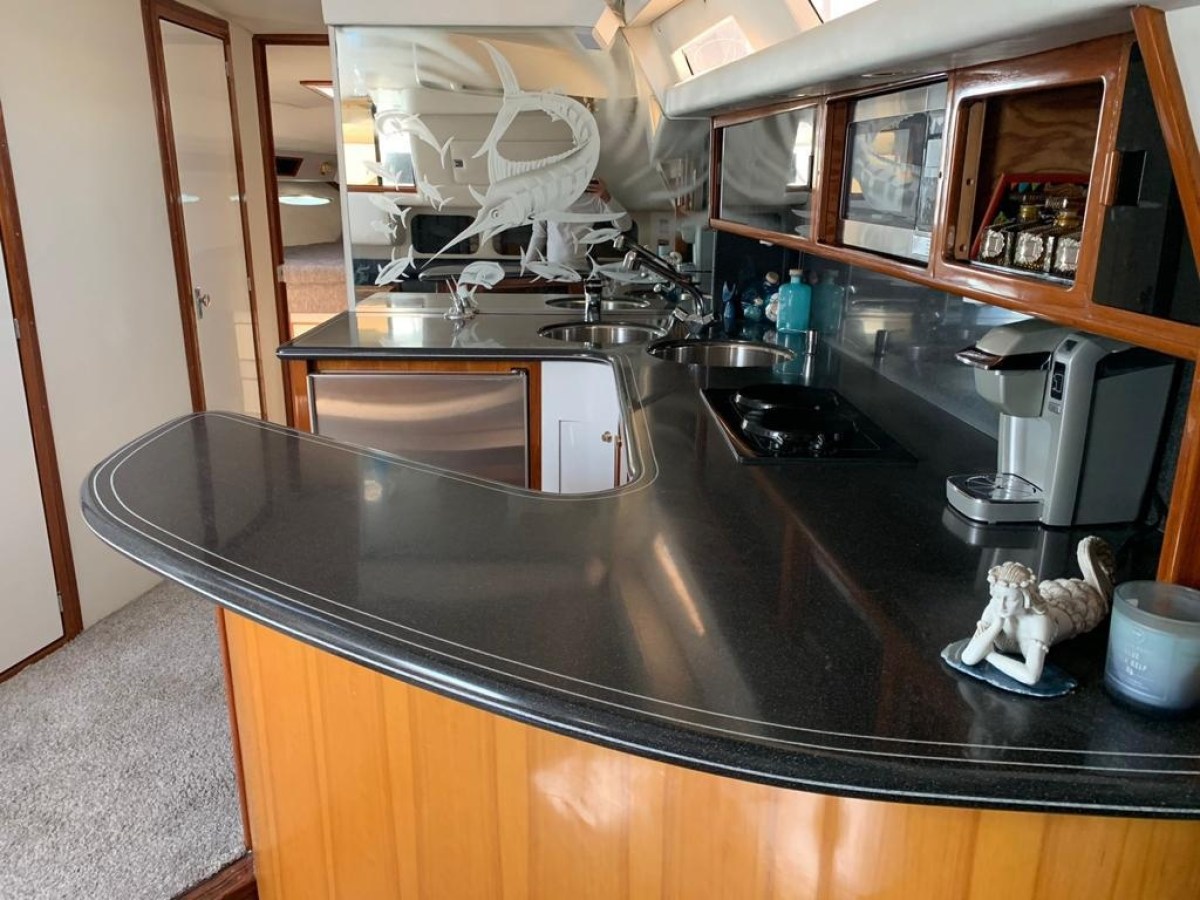 a stove top oven sitting inside of a kitchen