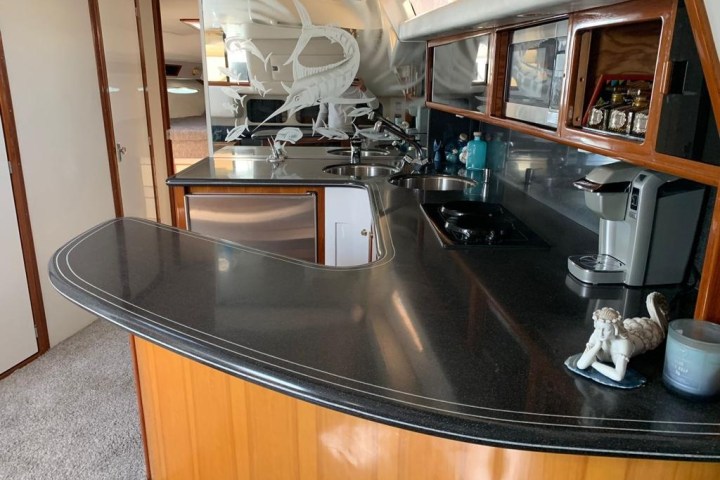 a stove top oven sitting inside of a kitchen