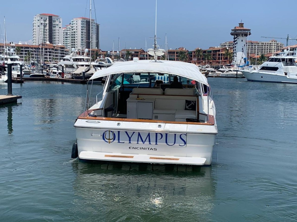 a boat is docked next to a body of water