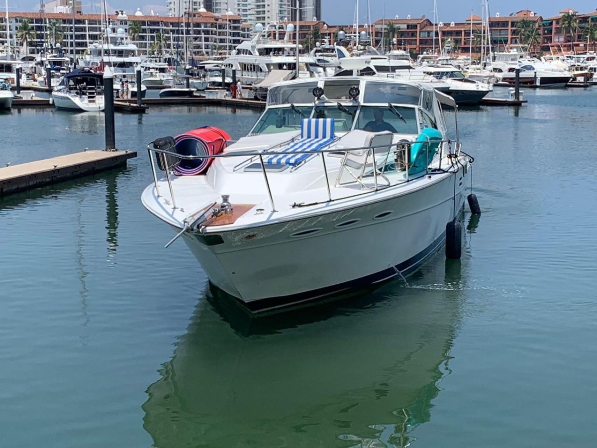 a boat is docked next to a body of water
