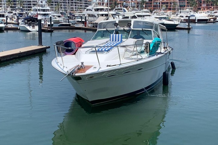 a boat is docked next to a body of water