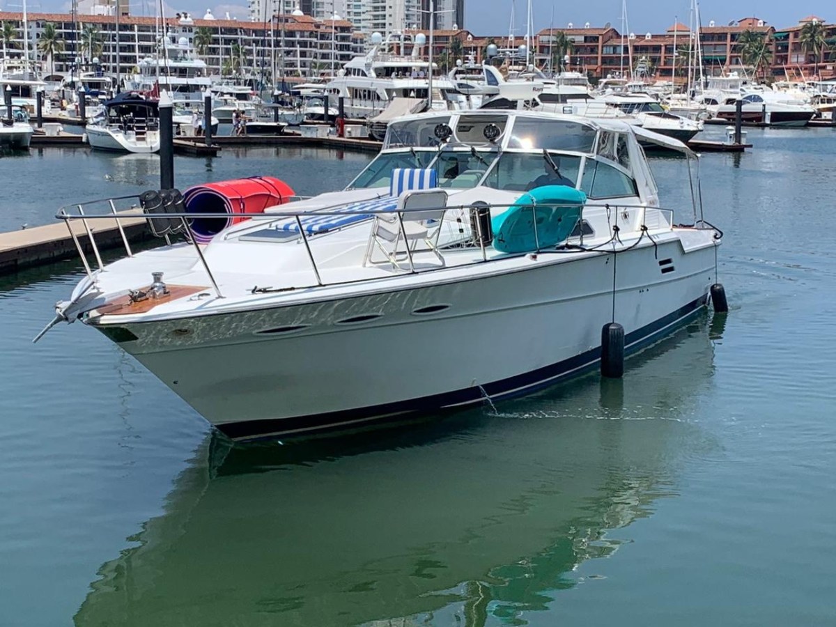 a boat is docked next to a body of water