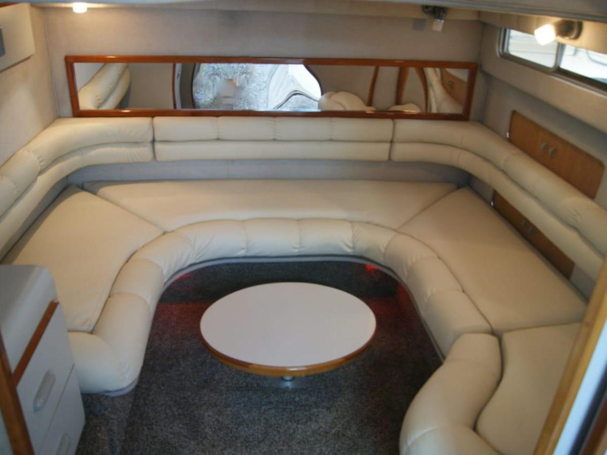 a chair sitting in front of a mirror posing for the camera