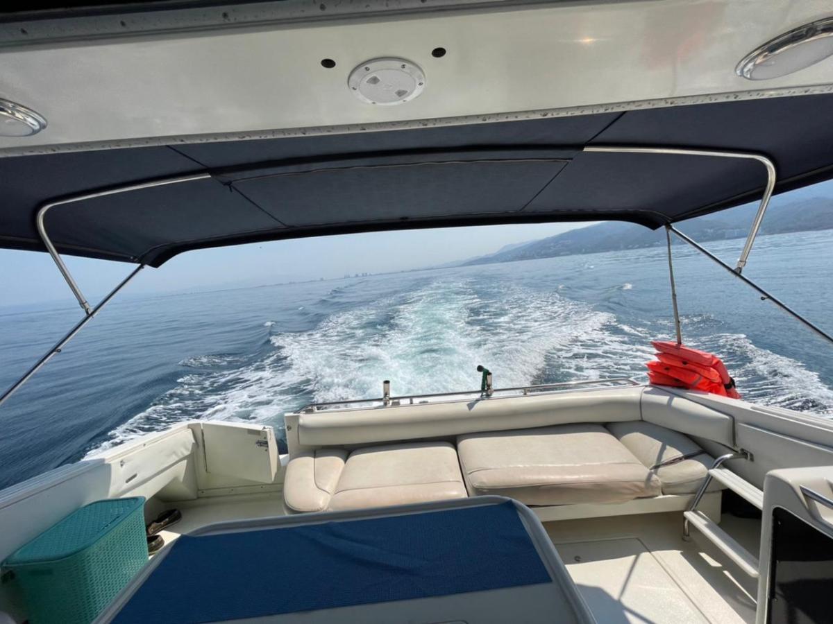 a boat sitting on top of a car