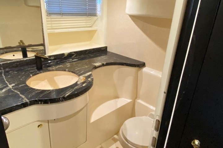 a person sitting at a sink