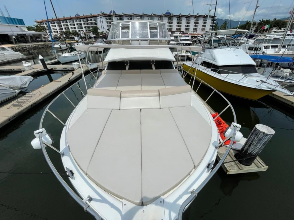 a boat is docked next to a body of water