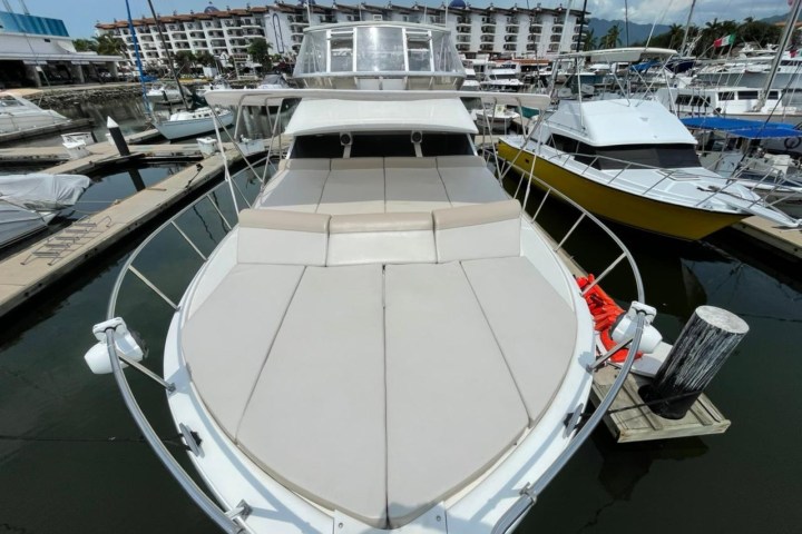 a boat is docked next to a body of water