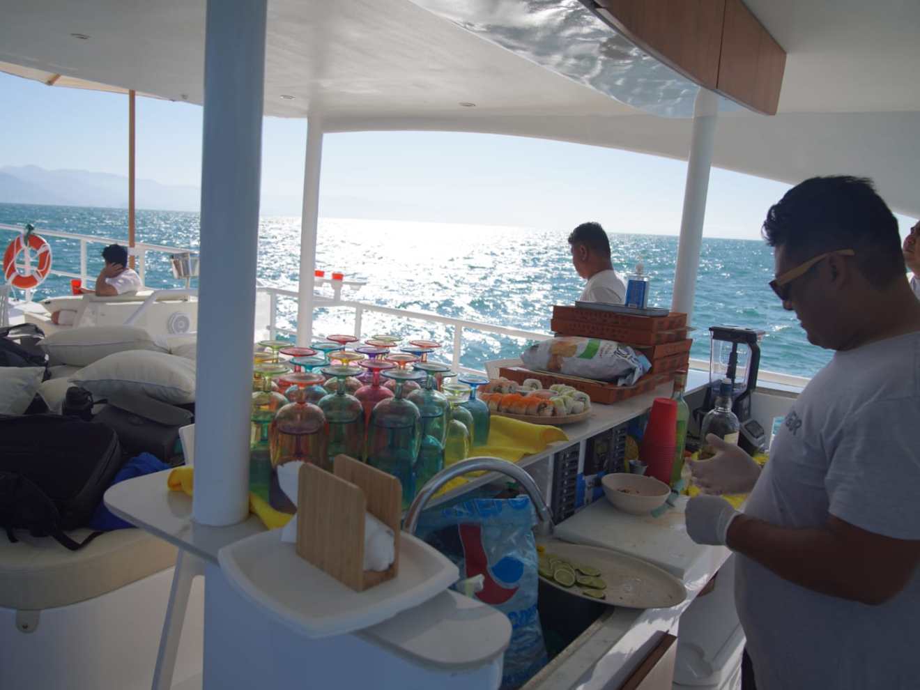 a group of people sitting at a beach