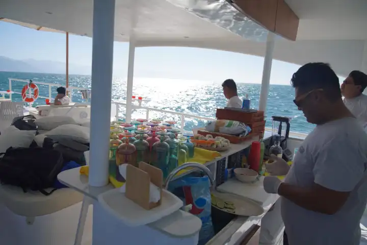 a group of people sitting at a beach