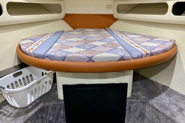 a stove top oven sitting inside of a car