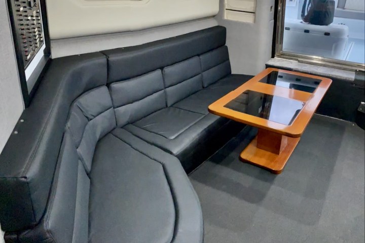 a laptop computer sitting on top of a car