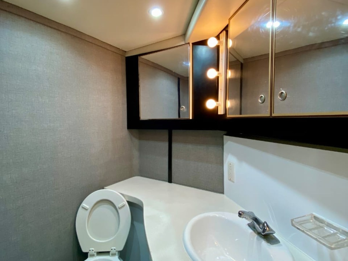 a restroom with a sink and a mirror