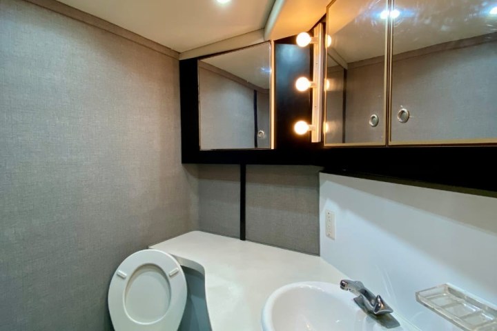 a restroom with a sink and a mirror