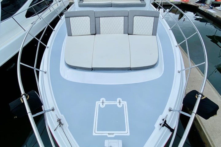 a boat docked next to a body of water